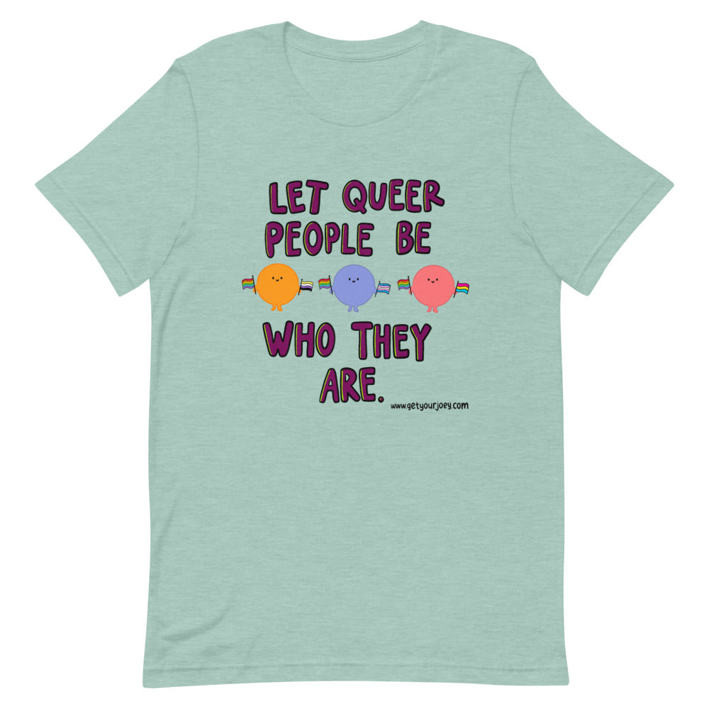 Purple text reads "Let Queer Be Who They Are" with 3 round cartoon people holding a variety of pride flags