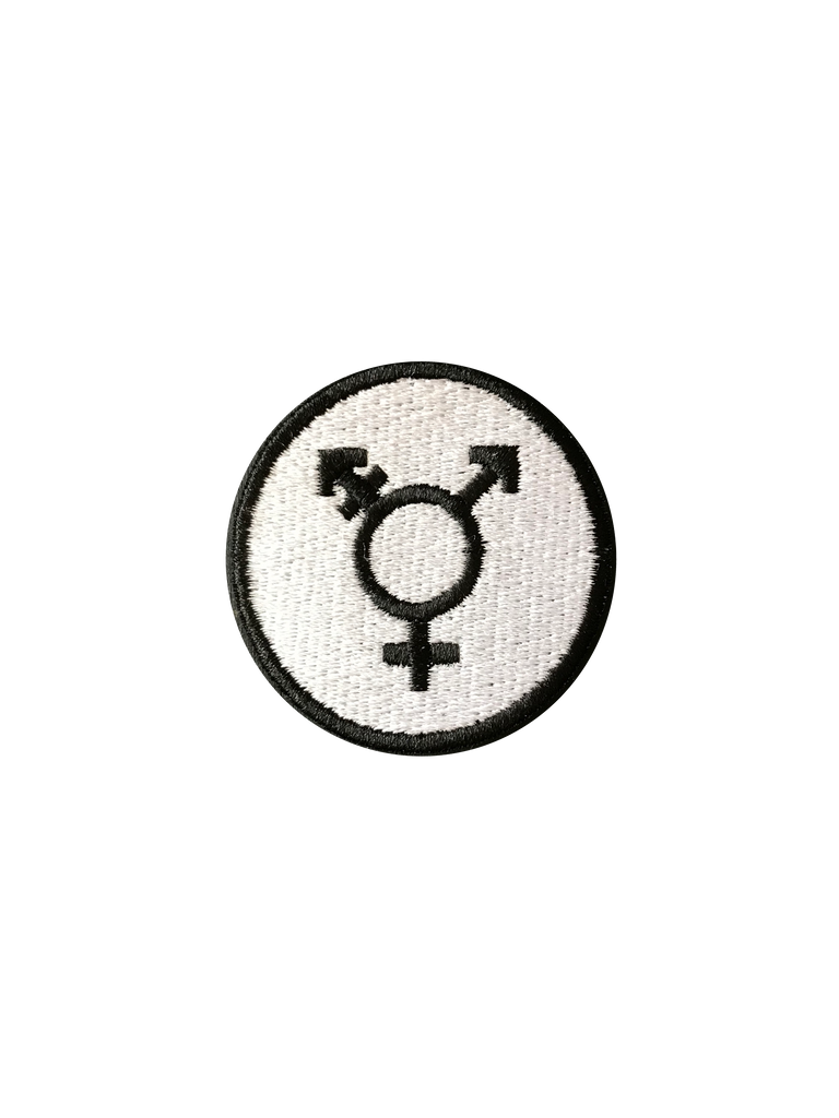 Circular Pride patch with a Black non-binary symbol on a white background.