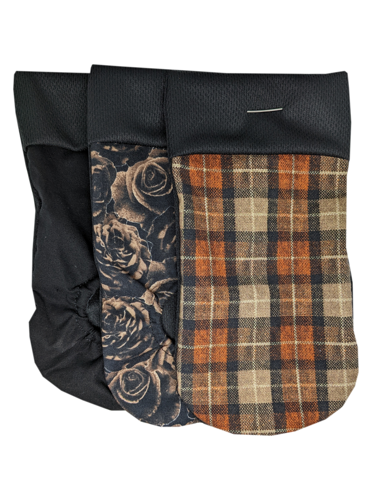  packing pouch for FTM, transmasculine and non-binary people. Joeys hold your packer in place. The Multipack contains 3 Joeys:  Orange Plaid No Hole: Orange, brown and yellow form a plaid pattern.  Roses Joeyo: Brown roses overlap on a black background.  Black Joeyo: Solid Black. 