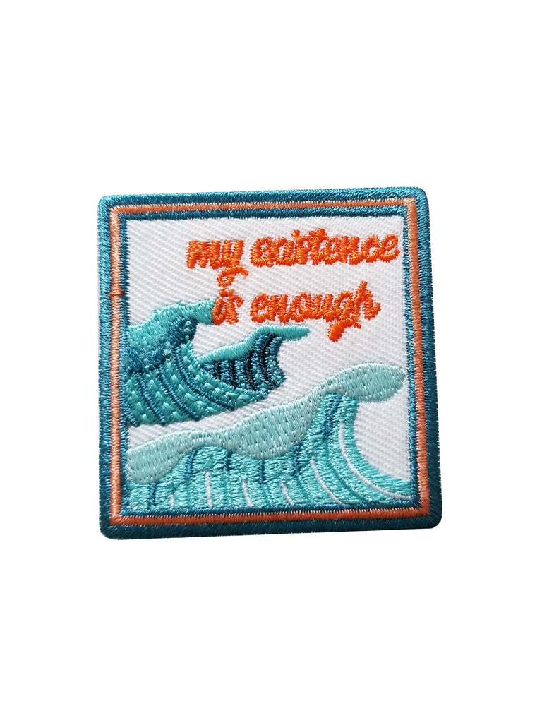 Square patch My Existence is Enough- © Meg Lee @megemikoart A blue and orange design with crashing waves and cursive text that reads "my existence is enough"